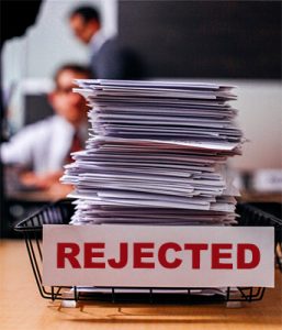 pile of papers marked "rejected"