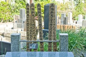 kaimyo on wooden stakes in Japanese graveyard