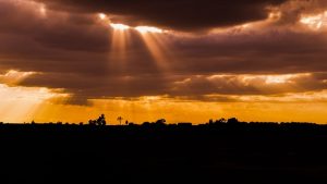 clouds with golden sun rays