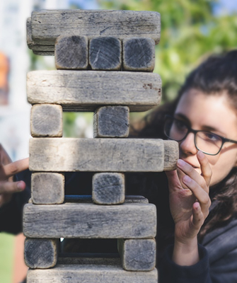 young woman playing Jenga