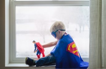 child dressed as Superman