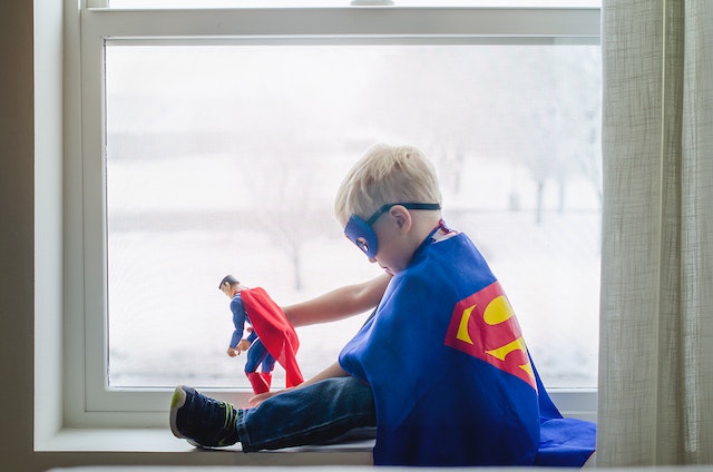 child dressed as Superman