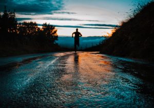 figure running on a road