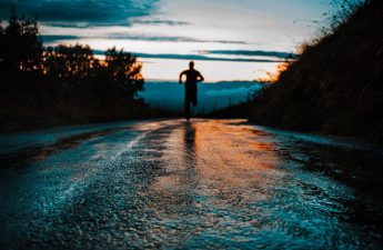 figure running on a road