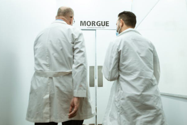 doctors in front of entrance to morgue